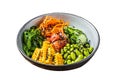 Poke bowl with fresh Salmon fish, rice, seaweed, edamame, cucumber and black sesame. Isolated, white background. Royalty Free Stock Photo