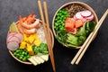 Poke bowls with shrimps, salmon, avocado and mango