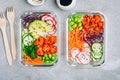 Poke meal prep containers with salmon, rice, radish, cucumber and avocado Royalty Free Stock Photo