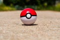 Pokeball on the asphalt road Royalty Free Stock Photo