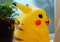 Pokemon center doll pikachu. doll pikachu in the garden. Pokemon is famous cartoon in Japan