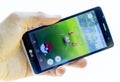 Pokemon Go game in a hand. Krabby Royalty Free Stock Photo
