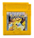 Pokemon yellow Version of Gameboy Color game chip on white background Royalty Free Stock Photo