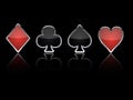 Poker card suits reflection black background Royalty Free Stock Photo