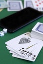 Poker cards and chips.black royal flush cards with dice and phone in casino Royalty Free Stock Photo