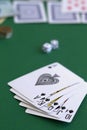 Poker cards and chips.black royal flush cards with dice and phone in casino Royalty Free Stock Photo