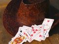 Poker cards and cowboy hat