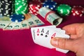 Poker cards with five of a kind combination. Close up of gambler hand takes playing cards in casino