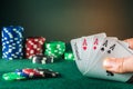 Poker cards with five of a kind combination. This is the maximum win. Close up of gambler hand takes playing cards in poker club Royalty Free Stock Photo