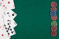 Poker cards on the left side and chips on the right side with green background on the rest of the image Royalty Free Stock Photo