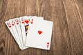 Poker cards over an old wooden table. Royalty Free Stock Photo