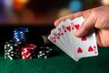 Poker cards with straight flush combination in the game. Close-up of a gambler hand is holding playing cards in poker club. Chips Royalty Free Stock Photo