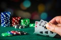 Poker cards with three of a kind or set combination. Close up of gambler hand takes playing cards in poker club Royalty Free Stock Photo