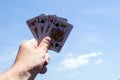 Poker cards on white backgrounds.Four kings in hand Royalty Free Stock Photo