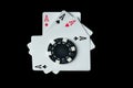 Poker cards with a winning combination of four of a kind or quads and a chip on a black table in a club Royalty Free Stock Photo