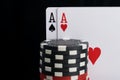 Poker chips and cards, close-up on a black background Royalty Free Stock Photo