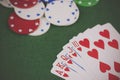 Poker chips and cards on a green table Royalty Free Stock Photo