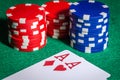 Poker chips and cards with two aces at the poker table Royalty Free Stock Photo