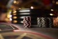 Poker chips colorful gaming pieces lie on the game table in the stack. Royalty Free Stock Photo