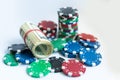 Poker chips, dollars on white background. Royalty Free Stock Photo