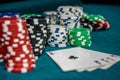 Poker chips with four aces at table in casino Royalty Free Stock Photo