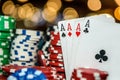 Poker chips with four aces at table in casino Royalty Free Stock Photo