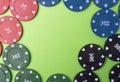 Poker chips on a green background. Place for text. From above Royalty Free Stock Photo