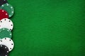 Poker chips on green felt casino table. Gambling, poker, blackjack and roulette theme Royalty Free Stock Photo