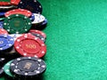 Poker chips on green felt table Royalty Free Stock Photo