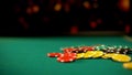 Poker chips lying on green table, poker and blackjack casino games, betting