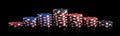 Poker chips neatly exhibited by a pyramid on a black background, long photo Royalty Free Stock Photo