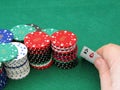 Poker chips & pair of aces in hand Royalty Free Stock Photo