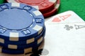 Poker chips pile and aces detail Royalty Free Stock Photo