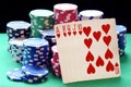 Poker chips pile and royal flush combination of cards Royalty Free Stock Photo