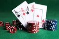 Poker chips, playing cards and red dice on green table Royalty Free Stock Photo