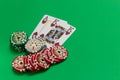 Poker chips stack and playing cards - ace and king  on green table Royalty Free Stock Photo