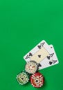 Poker chips stack and playing cards on green table Royalty Free Stock Photo