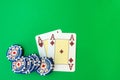 poker chips stack and playing cards on green table. Royalty Free Stock Photo