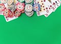 Poker chips stack and playing cards on green table Royalty Free Stock Photo