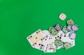 Poker chips stack and playing cards on green table. Royalty Free Stock Photo