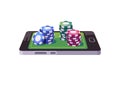 Poker chips stacked on smartphone screen. Online casino concept