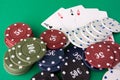 Poker cloth a deck of cards poker hand and chips. Background Royalty Free Stock Photo