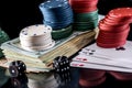 Poker combinations - chips, money and card isolated on black Royalty Free Stock Photo