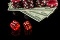 Poker dice with winning combination of eleven on black table and chips with dolars in the background Royalty Free Stock Photo