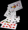 Poker falling cards on black background. Joker card Royalty Free Stock Photo