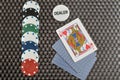 Poker game with poker chips, dealer chip and three cards