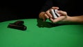 Poker game - shuffling cards. Man`s hands shuffing cards. Close up