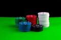 Poker game, stacks of chips on a poker table on a black background Royalty Free Stock Photo