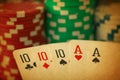 Poker hand with full house cards and jeton chips in close up on black backgrund - made like an old photo Royalty Free Stock Photo