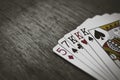 Poker Hands - Three Of A Kind. Closeup view of five playing cards forming the poker three of a kind hand. Royalty Free Stock Photo